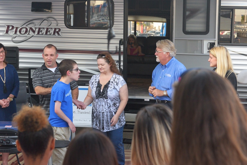 Capt. Steven Braddick, Weapons Station Engineering Element Chief with the 628th Air Base Wing Civil Engineer Squadron, his wife Renee Braddick, and their son Nathan James Braddick, are presented with a new camper trailer as part of a Make-A-Wish event in Charleston, S.C. on November 7, 2017. The event was hosted by the Subaru of Charleston dealership. Nathan was nominated to receive the Make-A-Wish donation by members of the Hands of Hope Organization.