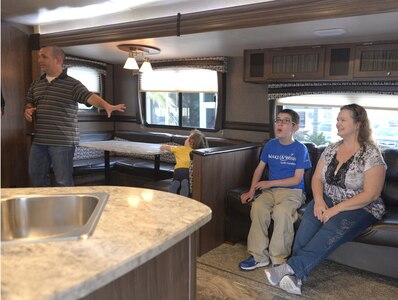 Capt. Steven Braddick explores his family’s new camper trailer with his two-year-old Nicholas, 16-year-old Nathan and his wife, Renee on November 7, 2017 in Charleston, S.C. Nathan was selected to receive a gift from the Make-A-Wish Foundation due to his severe illness, MECP2 duplication syndrome.