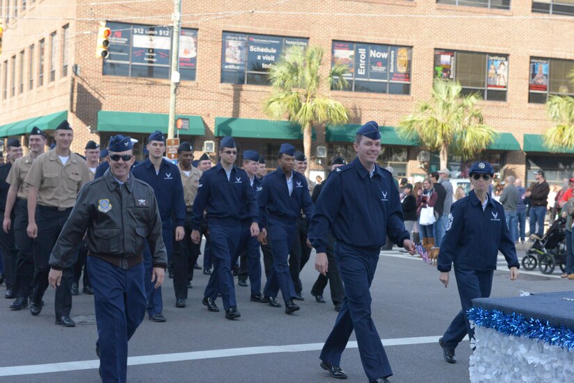 Col. Patrick Winstead, left, 437th Airlift Wing Vice Commander, Col. Jeffery Nelson, center, 628th Air Base Wing Commander, and Chief Master Sgt. Jennifer Kersey, right, 437th Airlift Wing Command Chief, lead a joint formation of JB Charleston service-members in the annual Veterans Day parade in downtown Charleston, S.C. on November 11, 2017. The formation included service members from the U.S. Air Force, Navy and Coast Guard.