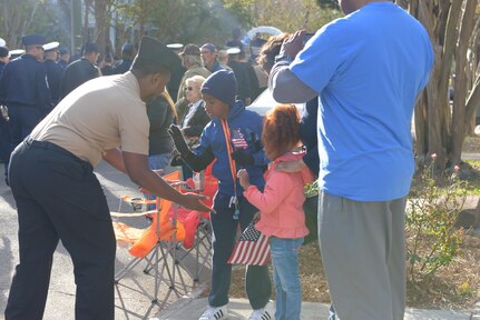 JB Charleston sailor high-fives children in the audience during the annual Veteran’s Day parade in Charleston, S.C. on Saturday, November 11, 2017. The parade was presented by the Ralph H. Johnson V.A. Medical Center.