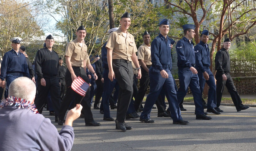 Service-members of the U.S. Air Force, Navy, and Coast Guard assigned to JB Charleston greet the community during the Veterans Day parade in downtown Charleston, S.C. on Saturday, November 11, 2017. The parade was presented by the Ralph H. Johnson V.A. Medical Center.