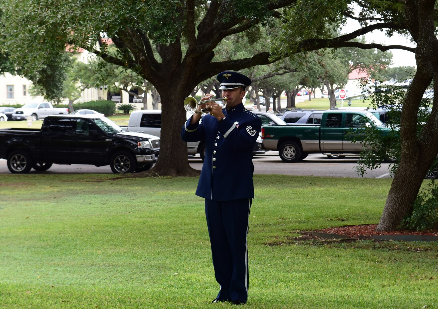Tech. Sgt. David Evans, a musician with the U.S. Air Force Band of the West plays Taps on his trumpet during a funeral for Senior Master Sgt. Karen Marshall and her husband Robert Scott Marshall Nov. 9, 2017 at Joint Base San Antonio-Randolph.  Scott and Karen were killed in a shooting at First Baptist Church in Sutherland Springs, Texas Nov. 5, 2017.  Scott was a civilian employee with the 12th Flying Training Wing and an Air Force Veteran.  Karen was an Active Guard and Reserve Airman transitioning from an assignment at Joint Base Andrews, Maryland.