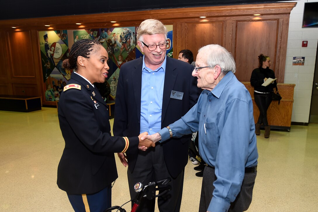 Army Reserve Lt. Col. Priscilla Van Zanten, right, Transportation Officer, 85th Support Command, speaks with a veteran moments before taking the stage as the keynote speaker at Buffalo Grove’s Veteran’s Day ceremony on Nov. 11, 2017 at the Buffalo Grove High School.