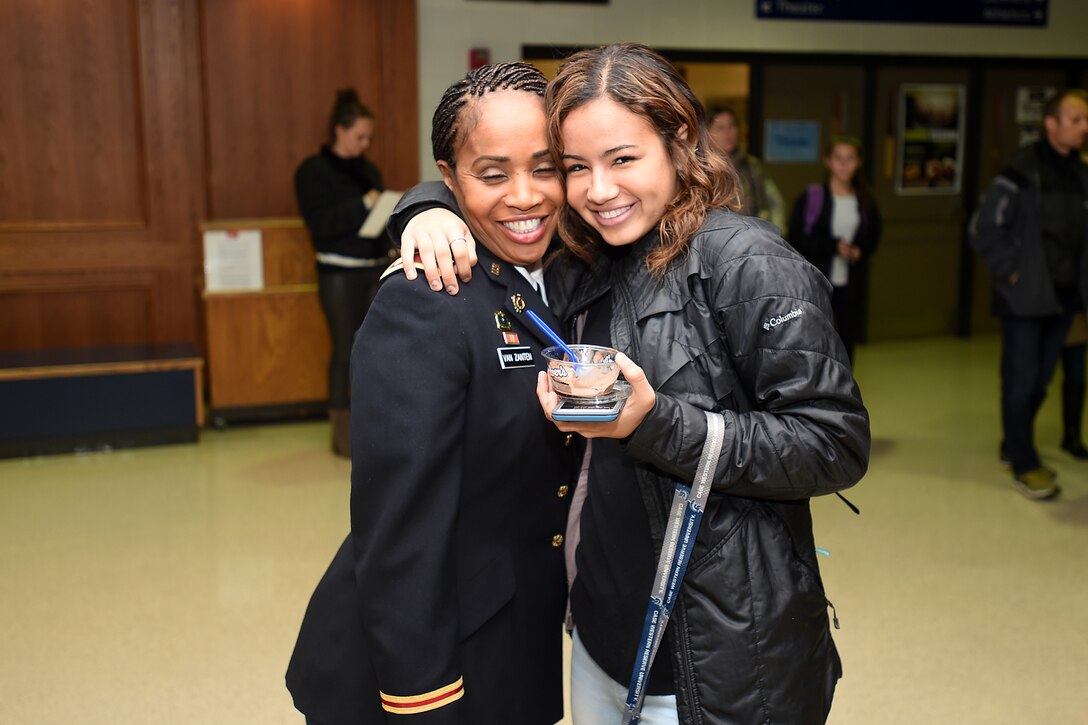 Army Reserve Lt. Col. Priscilla Van Zanten, left, 85th Support Command, receives a hug from her eldest daughter, Brianna, at a Veteran’s Day ceremony in Buffalo Grove on Nov. 11, 2017.