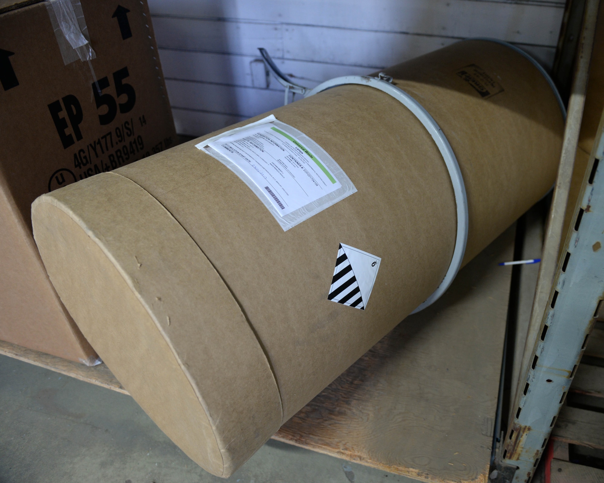 A properly sealed and labeled fiber board container with fluorescent lamps inside awaits being transported to a local recycling facility at Joint Base Elmendorf-Richardson, Alaska, Nov. 8 2017. Containers must be closed, structurally sound, compatible with the contents of the lamps and must prevent leakage or damage that could cause releases of mercury or other hazardous constituents to the environment under reasonably foreseeable conditions.