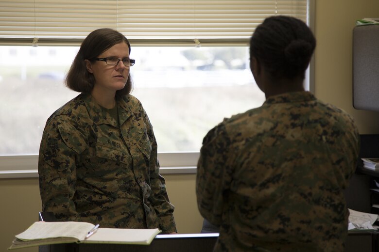 CAMP FOSTER, OKINAWA, Japan – Staff Sgt. Julianna Pinder speaks to a Marine in the Headquarters and Support Battalion Family Readiness Office Nov. 6 aboard Camp Foster, Okinawa, Japan.