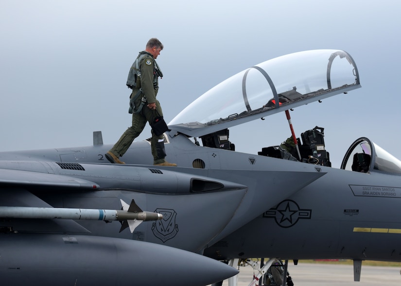 A U.S. Air Force pilot from Mountain Home Air Force Base, Idaho, performs a pre-flight check on an F-15E Strike Eagle parked on the flightline at Tyndall Air Force Base, Fla., Nov. 9, 2017. Mountain Home Airmen and assets were at Tyndall participating in Checkered Flag 18-1, a large-scale aerial exercise designed to integrate fourth and fifth-generation airframes while providing a platform for maintenance teams to be evaluated. (U.S. Air Force photo by Airman 1st Class Isaiah J. Soliz/Released)