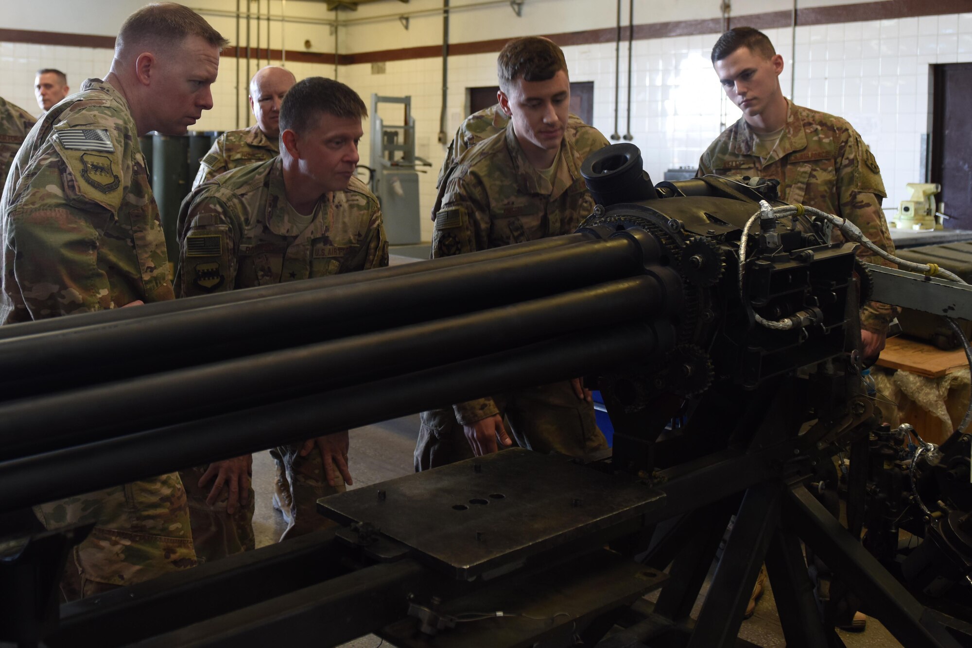 Airmen from the 447th Expeditionary Aircraft Maintenance Squadron and U.S. Air Force Brig. Gen. Kyle Robinson, 332nd Air Expeditionary Wing commander, inspect a 30 millimeter GAU-8 Avenger seven-barrel Gatling Gun undergoing repairs Nov. 7, 2017, at Incirlik Air Base, Turkey.