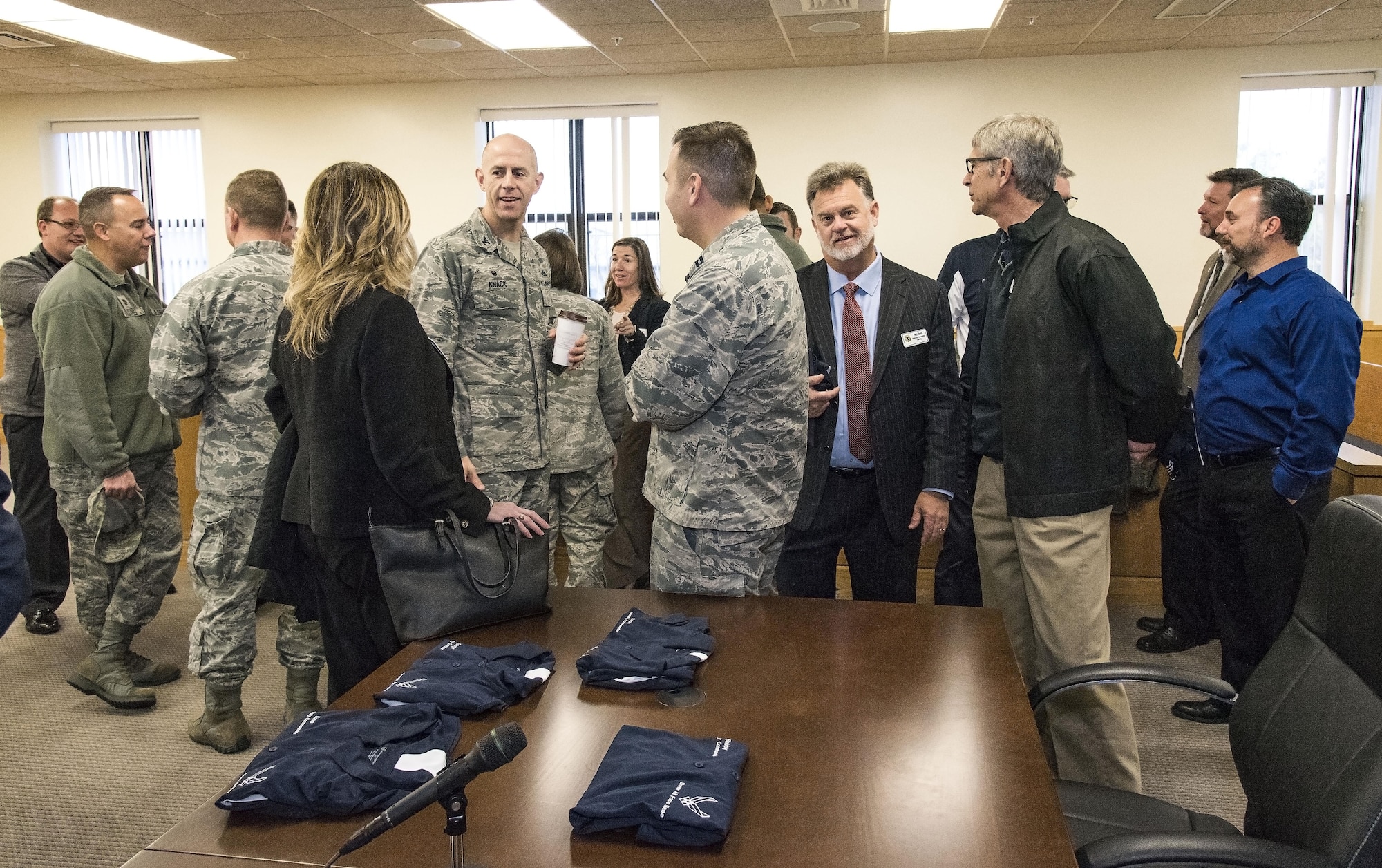 Team Dover members and honorary commanders socialize in the Legal Office court room prior to their tour of the 436th Airlift Wing Staff Agencies Nov. 8, 2017, on Dover Air Force Base, Del. The honorary commanders received mission briefings, toured various facilities and met with Team Dover WSA members during their half-day visit. (U.S. Air Force photo by Roland Balik)