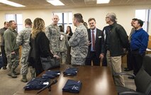 Team Dover members and honorary commanders socialize in the Legal Office court room prior to their tour of the 436th Airlift Wing Staff Agencies Nov. 8, 2017, on Dover Air Force Base, Del. The honorary commanders received mission briefings, toured various facilities and met with Team Dover WSA members during their half-day visit. (U.S. Air Force photo by Roland Balik)