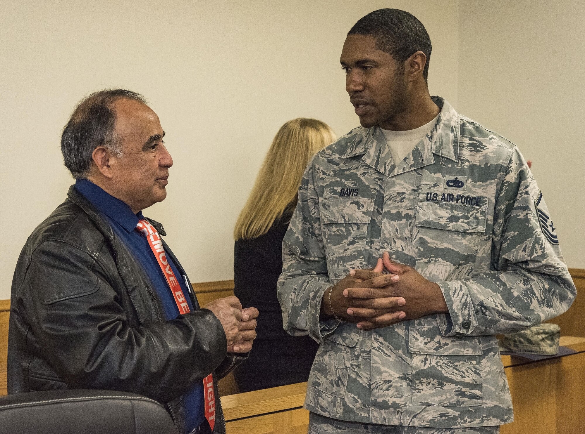 Elisio Valenzuela, 512th Maintenance Group honorary commander, speaks with Master Sgt. Harold Davis, Detachment 3, 373rd Training Squadron detachment chief, before their tour of the 436th Airlift Wing Staff Agencies Nov. 8, 2017, on Dover Air Force Base, Del. Twenty 436th and 512th AW honorary commanders toured the 436th AW staff agencies. (U.S. Air Force photo by Roland Balik)