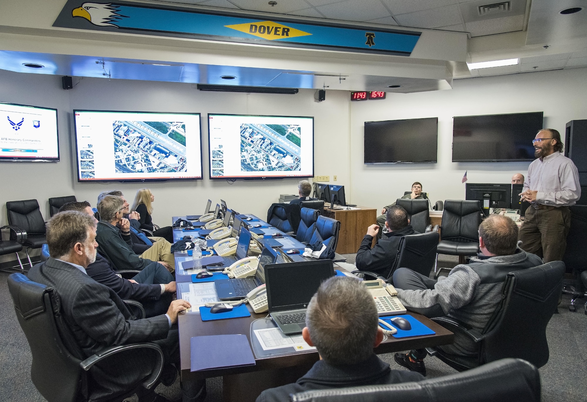 Mike Bouchard, 436th Airlift Wing Plans and Programs chief of operational plans, briefs honorary commanders on the role of crisis action team members when they convene in the installation control center Nov. 8, 2017, on Dover Air Force Base, Del. Bouchard explained to the honorary commanders regarding various situations when the CAT may be activated due to real-world or exercise occurrences. (U.S. Air Force photo by Roland Balik)