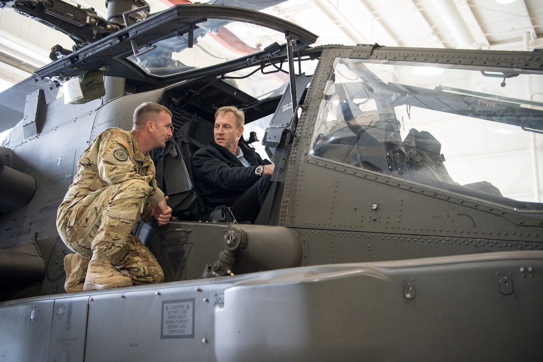 Deputy Defense Secretary Pat Shanahan sits in a helicopter.