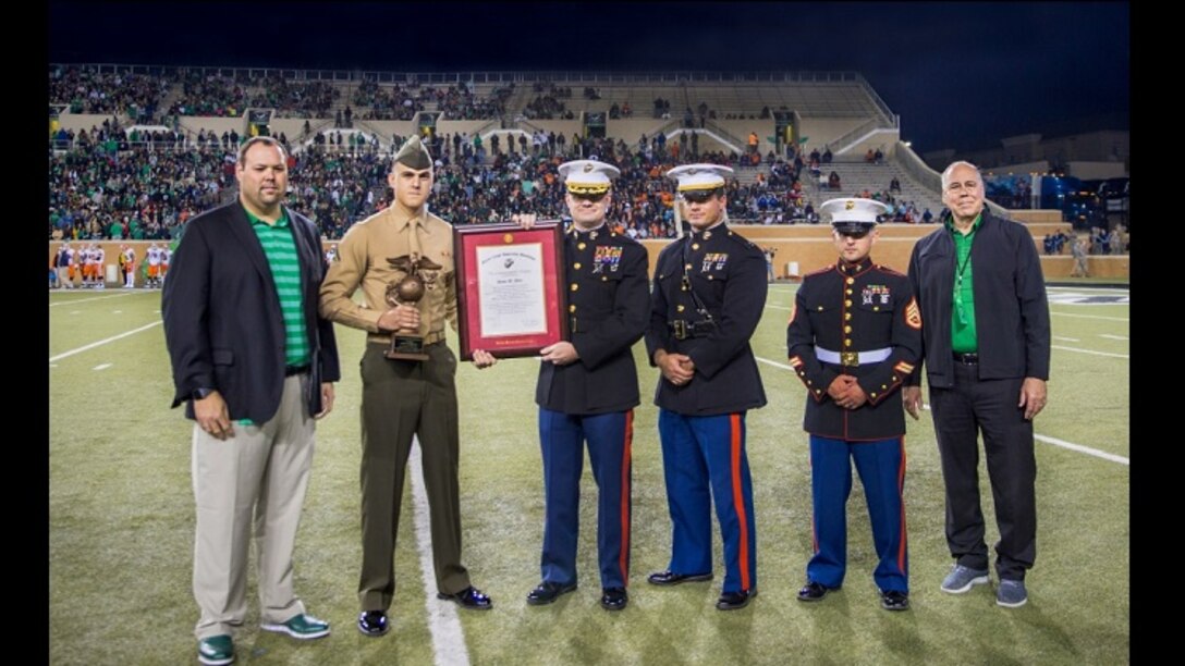 Lance Cpl. Devin Allen, an intelligence specialist with Marine Corps Forces Reserve and full-time student at the University of North Texas is awarded the Commandant's Award Nov. 11, 2017. The award is the highest honor a Marine Corps officer candidate can receive and is given to the top graduate of the Platoon Leaders Course's six-week long summer training program at Officer Candidate School. (Marine Corps photo by Sgt. Danielle Rodrigues/Released)