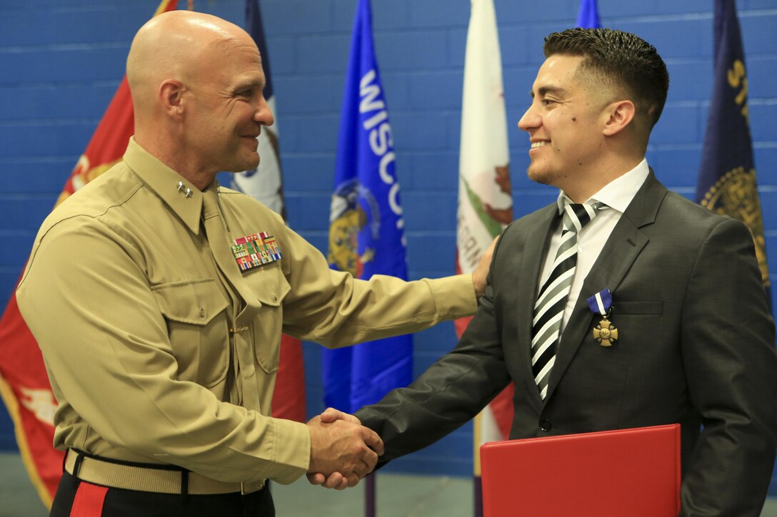 Marine Corps veteran Lance Cpl. Gonzalez receives award upgrade to Navy Cross.