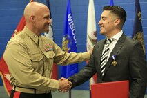 Marine Corps veteran Lance Cpl. Gonzalez receives award upgrade to Navy Cross.