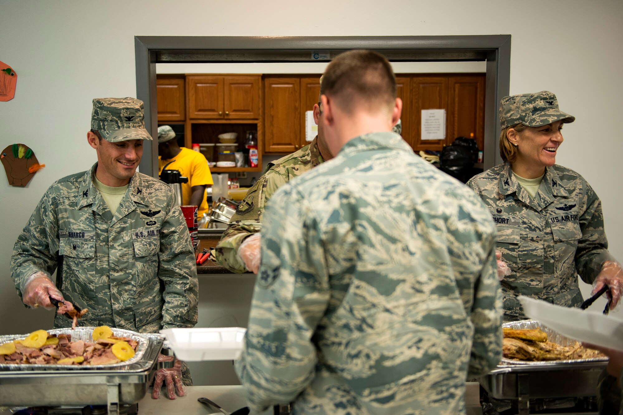 Team Moody leadership serves food during the Annual Airmen’s Thanksgiving luncheon, Nov. 14, 2017, at Moody Air Force Base, Ga. Moody Chiefs Group, with the support of various base organizations, held the luncheon because many Airmen are unable to return home for Thanksgiving. (U.S. Air Force photo by Airman 1st Class Erick Requadt)