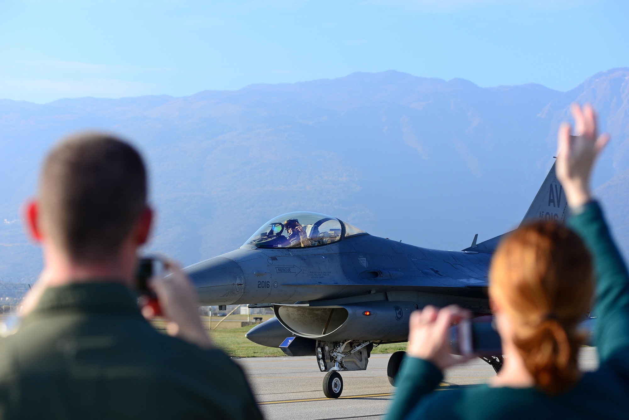 Team Aviano members welcome home an F-16 Fighting Falcon pilot from the 555th Fighter Squadron at Aviano Air Base, Italy, Nov. 1, 2017. Approximately 380 Airmen and 18 F-16s were deployed to Bagram Air Field, Afghanistan to support Operation Freedom’s Sentinel. (U.S. Air Force photo by Airman 1st Class Ryan Brooks)