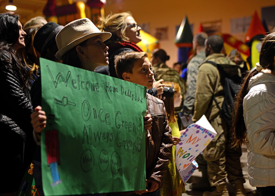 Children wait to welcome home their father at Aviano Air Base, Italy, Nov. 6, 2017. Their father was one of 380 Airmen to deploy to Bagram Air Field, Afghanistan in support of Operation Freedom’s Sentinel.  (U.S. Air Force photo by Airman 1st Class Ryan Brooks)