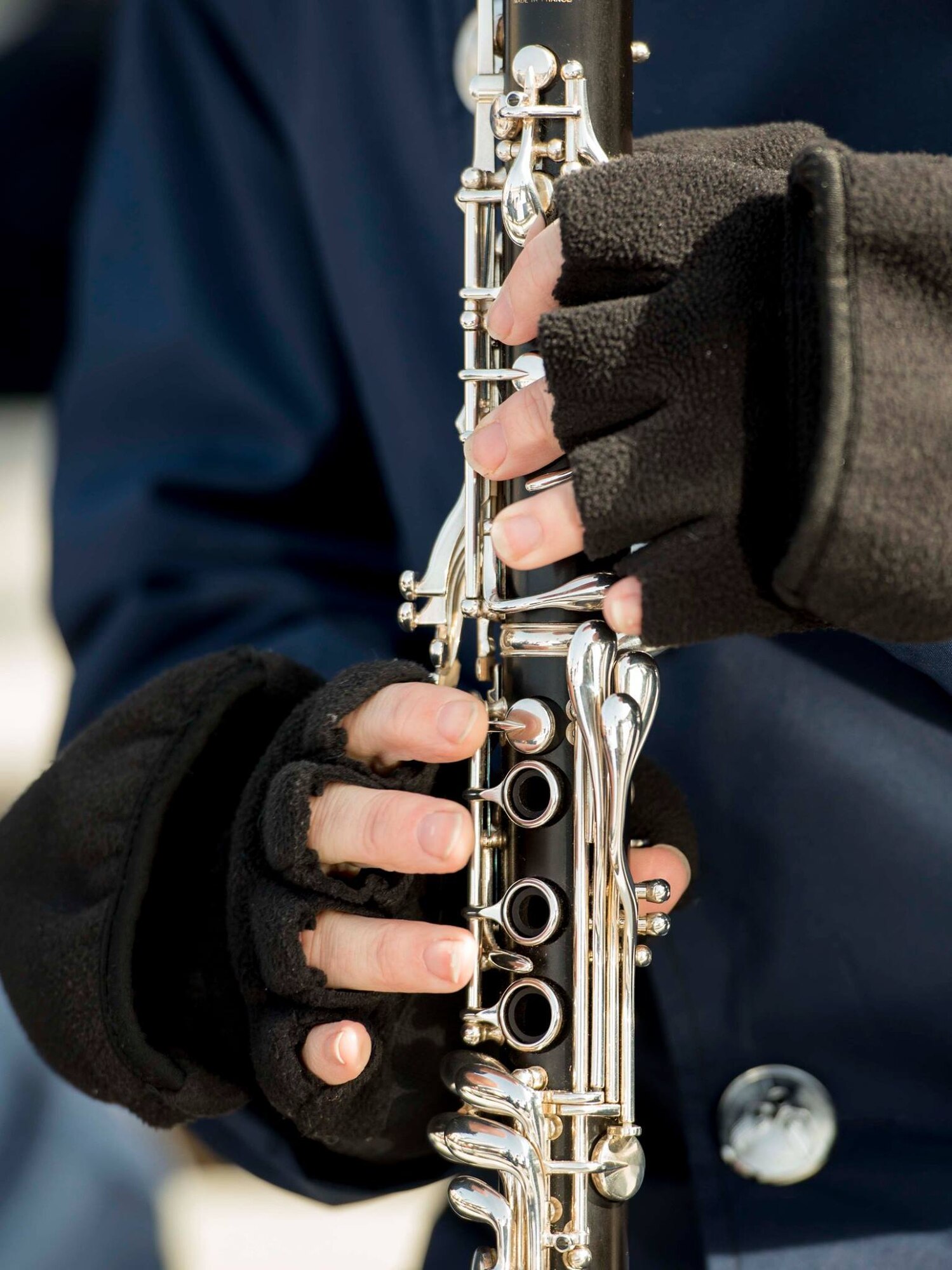 Close up of band member playing the clarinet
