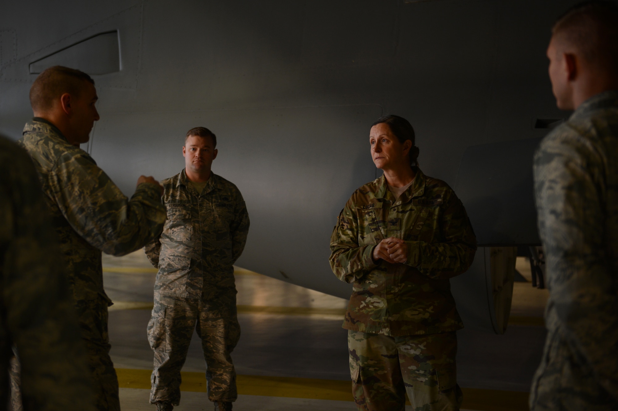 Army Col. Nicole Lucas, Joint Base Lewis-McChord garrison commander, listens to a brief about home station check, Nov. 6, 2017, on the McChord Field flightline.