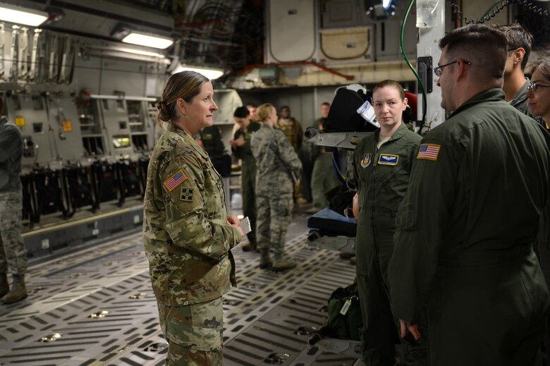 Airmen from the 446th Aeromedical Evacuation Squadron brief Army Col. Nicole Lucas, Joint Base Lewis-McChord garrison commander, on their mission, Nov. 6, 2017, in a C-17 on the McChord Field flightline.