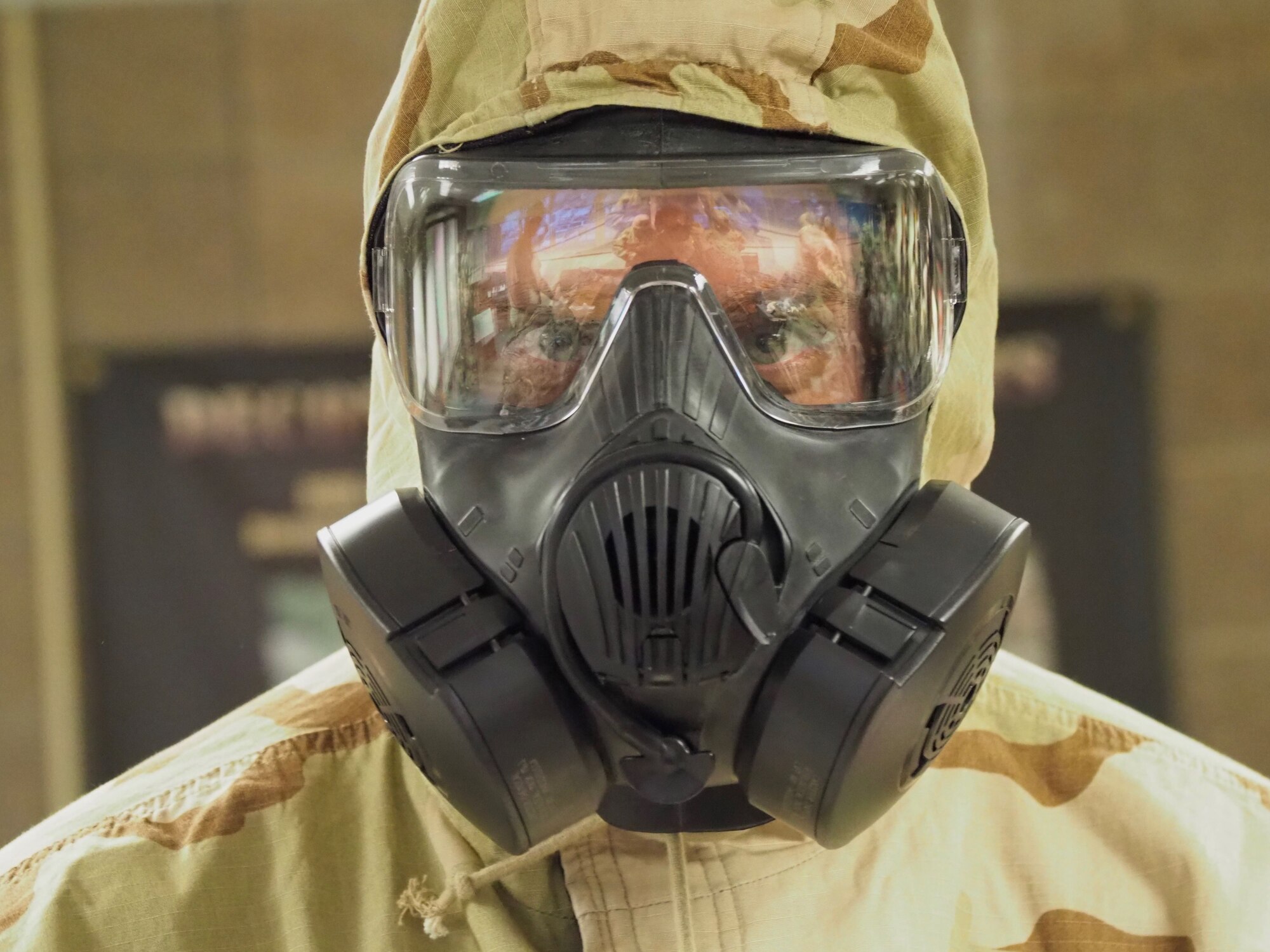 Tech. Sgt. Trevor Saylor tests out his gas mask as part of an Ability to Survive and Operate exercise Nov. 4. (Air Force Photo/Paul Zadach)