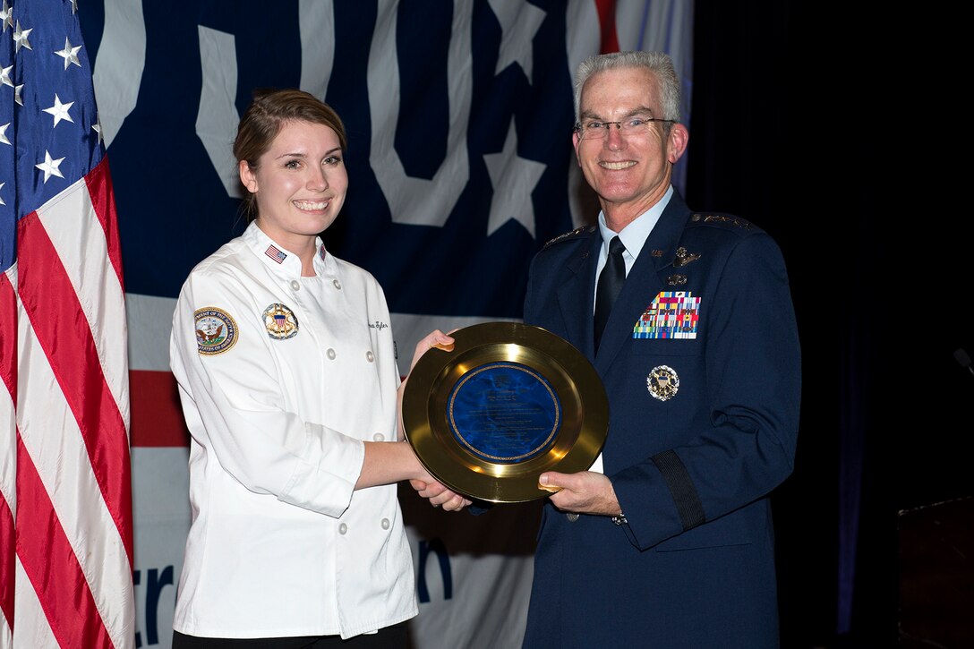 Air Force Gen. Paul J. Selva presents an award