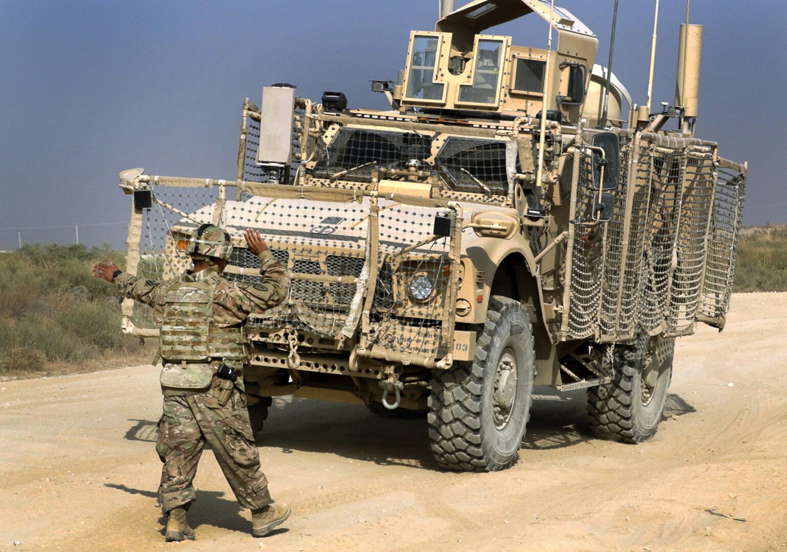 BAGRAM AIRFIELD, Afghanistan - Staff Sgt. Arturo Amaro, the master driver for the 3rd Special Troops Battalion, 3rd Infantry Division Resolute Support Sustainment Brigade, backs up a Oshkosh Defense mine-resistant, ambush-protected vehicle All-Terrain Vehicle (MAT-V) before the off-road portion of the master driver training course Nov. 8 at Bagram Airfield, Afghanistan. Amaro and a group from the 82nd Airborne Division conducted a two-week training course over a MAT-V, a MaxxPro II MRAP, and mine rollers to certify them to teach drivers in any of these three platforms. (U.S. Army photo by Spc. Elizabeth White with 3ID RSSB/Released)