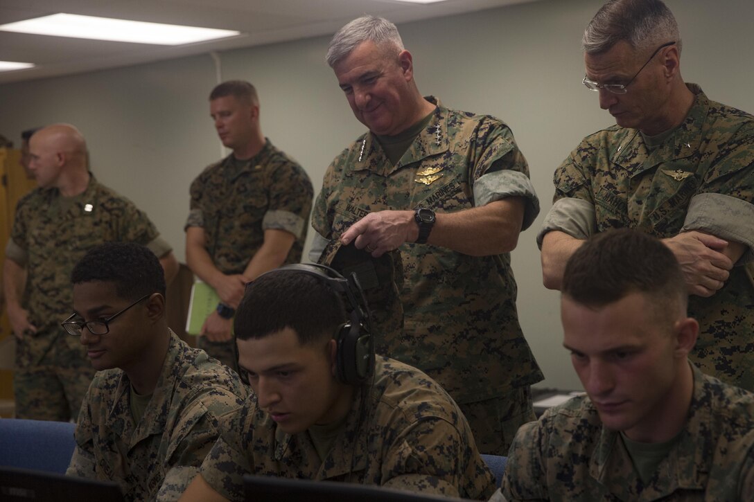 U.S. Marine Gen. Glenn M. Walters, Assistant Commandant of the Marine Corps, center, observes Marines from 3rd Battalion, 3rd Marine Regiment, conducting training using Virtual Battlespace 3 aboard Marine Corps Base Hawaii, Kaneohe Bay, Nov. 3, 2017. Gen. Walters visited the air station to speak with Marines and senior leadership to discuss the capabilities, readiness, and future challenges to Marines in the region and discussed the projection of power, production of readiness, and promotion of resiliency with current and future military projects.. (U.S. Marine Corps Photo by Sgt. Alex Kouns)