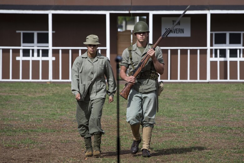 U.S. Marines Corps Sgt. Alexandra Aglio and Lance Cpl. Sean Post-Hutchinson, with Headquarters Battalion, Marine Corps Base Hawaii (MCBH), portray Marines from World War II as part of the annual Birthday Pageant aboard MCBH, Nov. 9, 2017. The birthday pageant celebrates the birthday of the Marine Corps and pays homage to the rich legacy of the Corps. (U.S. Marine Corps photo by Sgt. Alex Kouns/Released)