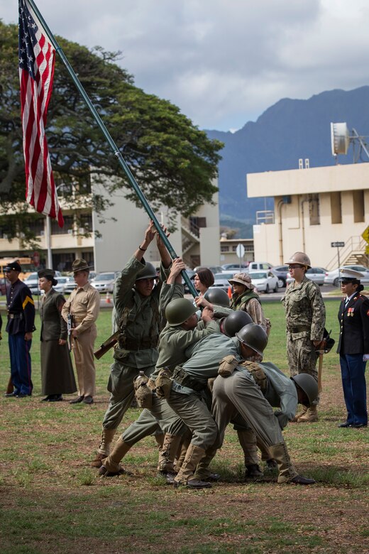 U.S. Marines with Headquarters Battalion, Marine Corps Base Hawaii, reenact the flag raising at Iwo Jima as part of the annual birthday pageant, MCBH, Nov. 9, 2017. The birthday pageant celebrates the birthday of the Marine Corps and pays homage to the rich legacy of the Corps. (U.S. Marine Corps photo by Sgt. Alex Kouns/Released)