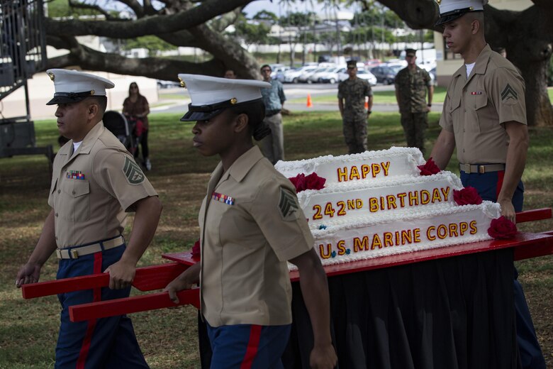 U.S. Marines with Headquarters Battalion, Marine Corps Base Hawaii, march the ceremonial birthday cake as part of the annual Birthday Pageant, MCBH, Nov. 9, 2017. The birthday pageant celebrates the birthday of the Marine Corps and pays homage to the rich legacy of the Corps. (U.S. Marine Corps photo by Sgt. Alex Kouns/Released)