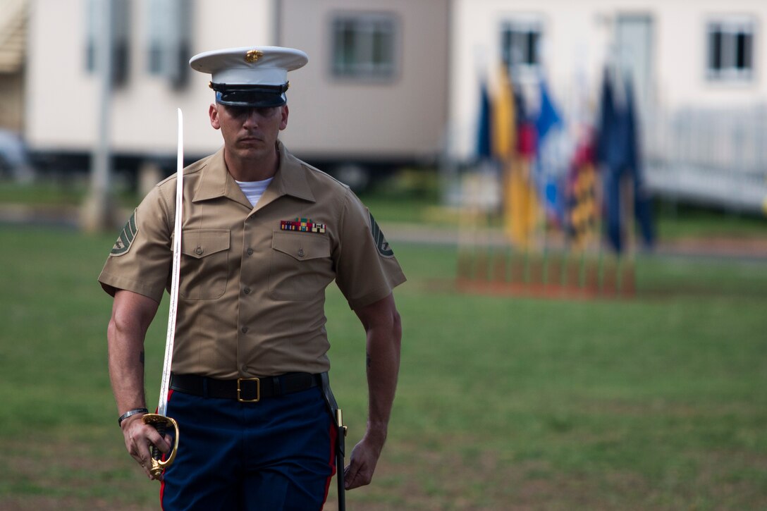 Staff Sgt. Joseph Clinton, a military police officer with the Provost Marshal’s Office, marches to his position during the U.S. Marine Corps birthday pageant, Marine Corps Base Hawaii, Nov. 9, 2017. The birthday pageant celebrates the birthday of the Marine Corps and pays homage to the rich legacy of the Corps. (U.S. Marine Corps photo by Lance Cpl. Luke Kuennen)