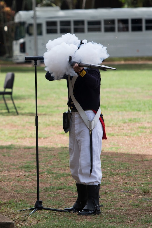 A historical role player discharges his black powder rifle prop during the U.S. Marine Corps birthday pageant, Marine Corps Base Hawaii, Nov. 9, 2017. The birthday pageant celebrates the birthday of the Marine Corps and pays homage to the rich legacy of the Corps. (U.S. Marine Corps photo by Lance Cpl. Luke Kuennen)