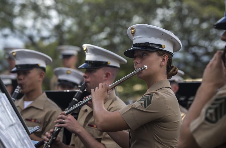 Sgt. Brooke Bart, a flutist with the U.S. Marine Corps Forces, Pacific band, looks to the conductor while playing at the Marine Corps birthday pageant, Marine Corps Base Hawaii, Nov. 9, 2017. The birthday pageant celebrates the birthday of the Marine Corps and pays homage to the rich legacy of the Corps. (U.S. Marine Corps photo by Lance Cpl. Luke Kuennen)