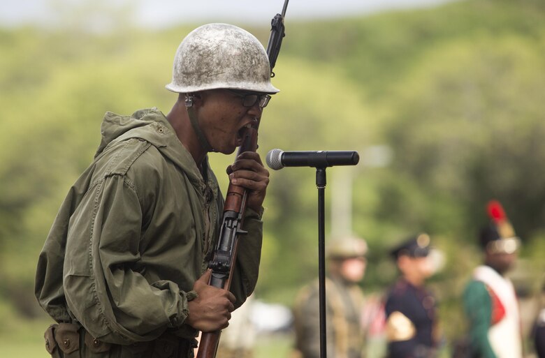 Lance Cpl. Keyshawn Patterson, a systems administrator with base communications, delivers his speech during the U.S. Marine Corps birthday pageant, Marine Corps Base Hawaii, Nov. 9, 2017. The birthday pageant celebrates the birthday of the Marine Corps and pays homage to the rich legacy of the Corps. (U.S. Marine Corps photo by Lance Cpl. Luke Kuennen)