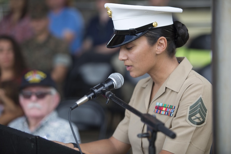 Staff Sgt. Alisa Helin, the Digital and Media Engagement staff noncommissioned officer-in-charge, Communications Strategy and Operations, narrates the U.S. Marine Corps birthday pageant, Marine Corps Base Hawaii, Nov. 9, 2017. The birthday pageant celebrates the birthday of the Marine Corps and pays homage to the rich legacy of the Corps. (U.S. Marine Corps photo by Lance Cpl. Luke Kuennen)