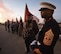 1st Sgt. Kerwin Williams, Marine Corps Honor Guard team leader, right, stands stoically against a colorful Oklahoma sky with members of the Oklahoma Patriot Riders in the background as they await the plane carrying the remains of Marine Corps Pvt. Vernon Paul Keaton November 14, 2017, Will Rogers World Airport, Oklahoma City, Oklahoma.