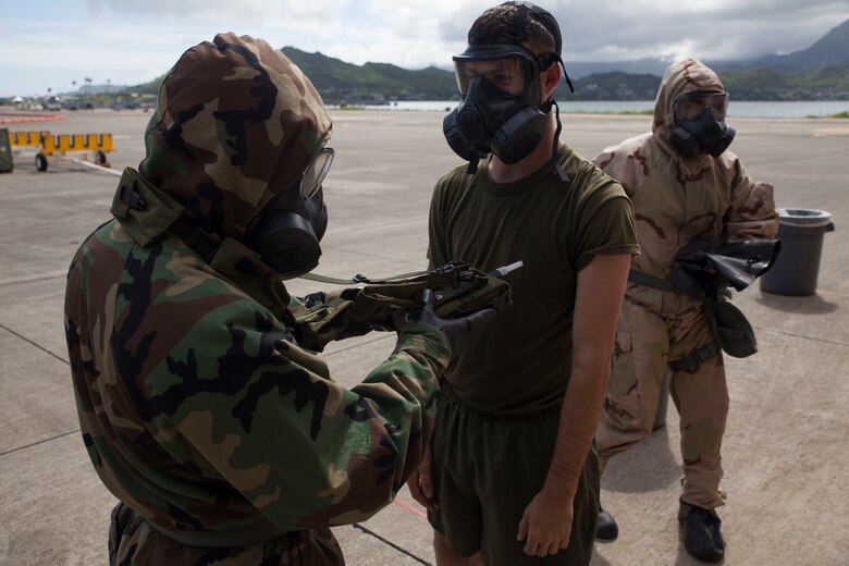 A U.S. Marine with Marine Heavy Helicopter Squadron  463, also known as “Pegasus,” Marine Aircraft Group  24, uses an M4 JCAD Chemical Hazard Detection Simulator to check for a simulated nerve agent after a detailed aircraft decontamination (DECON) exercise, Marine Corps Base Hawaii, Nov. 8, 2017. The DECON exercise instructed Marines on proper techniques and procedures with responding to a chemical, biological, radiological or nuclear contamination on a static helicopter. (U.S. Marine Corps photo by Cpl. Jesus Sepulveda Torres)