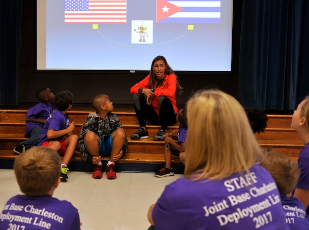 Airman 1st Class Christa Stankovic, 437th Operations Support Squadron member, gives children a pre-deployment briefing during a youth deployment line at Joint Base Charleston – Weapons Station, S.C., Nov. 4, 2017.
