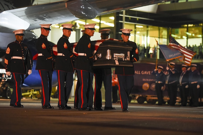 A Marine Corps carry team transfers the remains of Marine Pvt. Vernon Paul Keaton November 14, 2017, Will Rogers World Airport, Oklahoma City, Oklahoma. Keaton was killed Dec. 7, 1941, during the Japanese attack on Pearl Harbor, Hawaii.