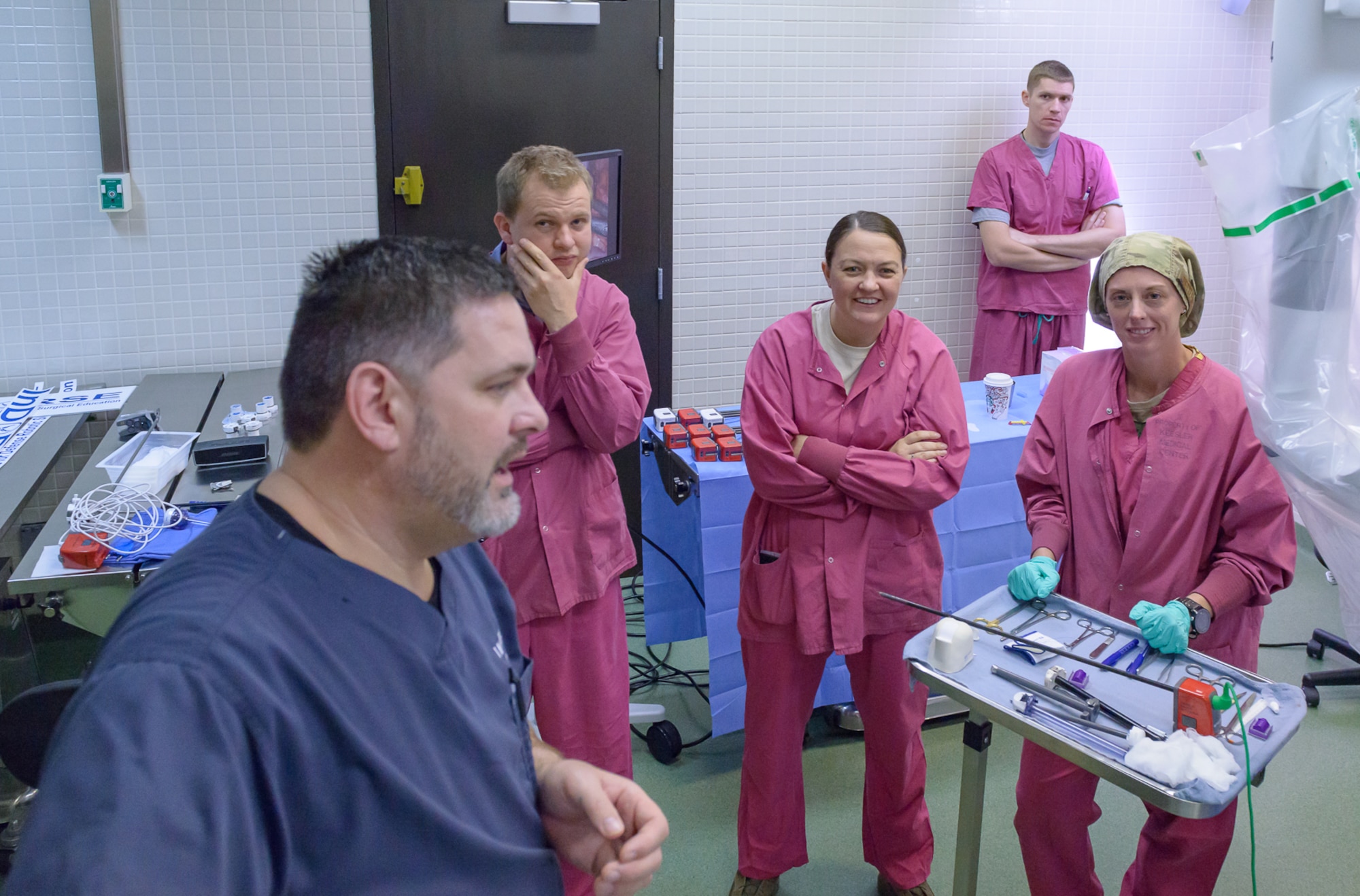 Jon Martin, Intuitive Surgical customer trainer, explains the DiVinci Xi surgical system at the Clinical Research Lab to Capt. Nichole Settlemires, 81st Surgical Operations Squadron preoperative nurse, Dr. Svyatoslav Guznor, 711th Human Performance Wing Airman systems directorate research psychologist, and Capt. Breanna Raney, 711th HPW Airman systems directorate program manager, Air Force Research Lab, Wright-Patterson Air Force Base, Ohio, Nov. 14, 2017, on Keesler Air Force Base, Mississippi. Guznor and Raney visited Keesler to get a better understanding of robotic surgery in the Air Force by touring the InDorse Lab and observing surgeons, nurses, and techs to get basic training on the Da Vinci machine. They also interviewed surgical staff and system trainers on their interactions with the robot and the team dynamics, and collaborated with the lead robotic surgeon about future joint ventures and research collaborations. (U.S. Air Force photo by Andre’ Askew)