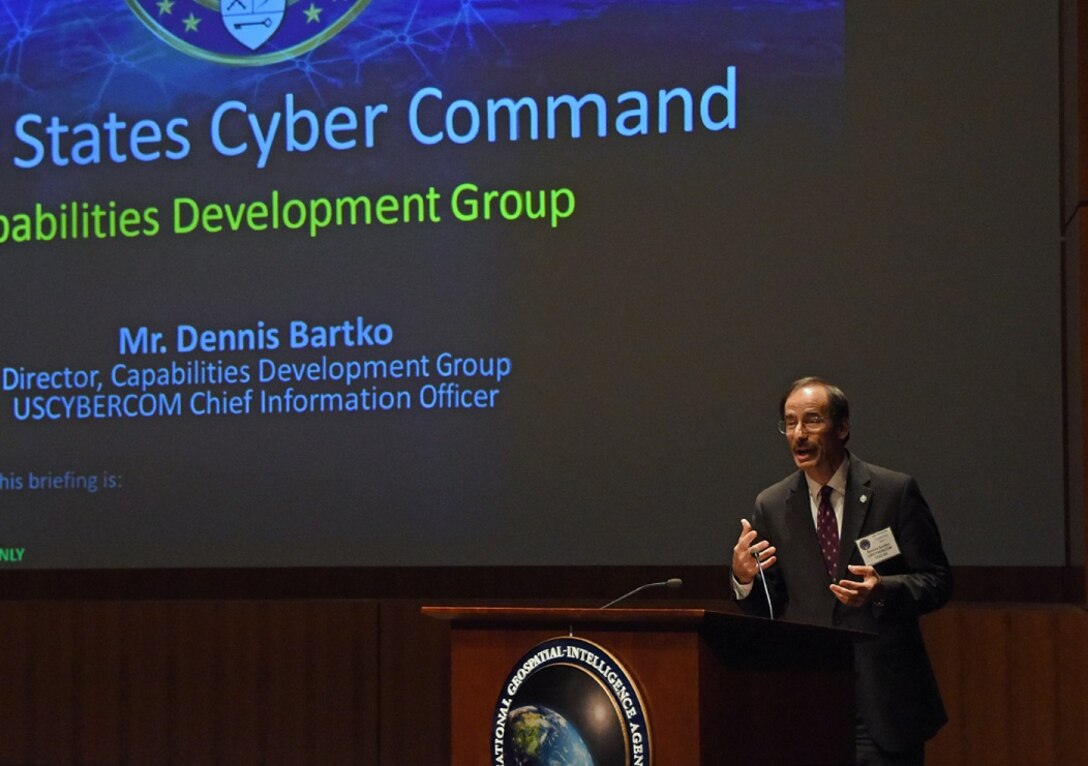 Dennis Bartko, the director of U.S. Cyber Command’s Capabilities Development Group, addresses attendees at the command’s first-ever industry day held at the National Geospatial-Intelligence Agency’s Arthur Lundahl Conference Center at Fort Belvoir, Va., Oct. 27, 2017. Leaders from across Cybercom briefed nearly 400 members of private industry about the command’s acquisition priorities. Courtesy photo
