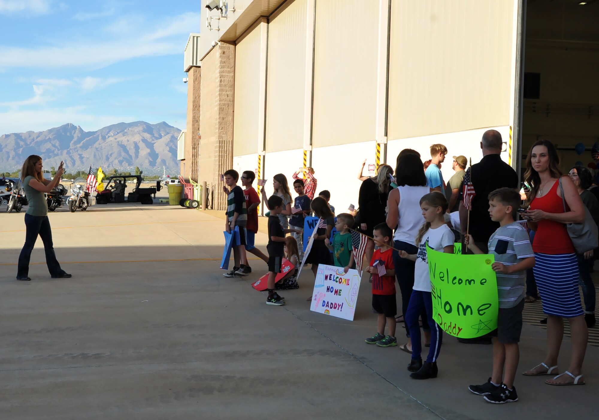 Family members and friend eagerly await the arrival of 943rd RQG Citizen Airmen.