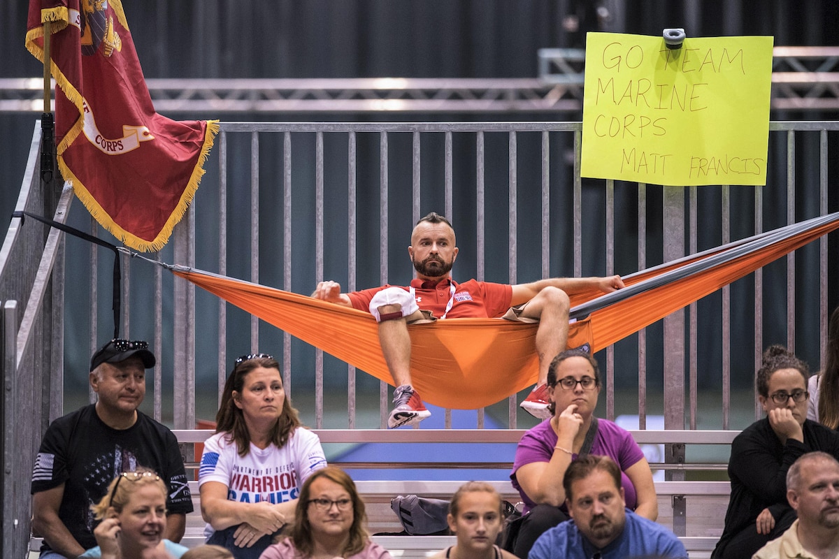 A Marine veteran rests in a hammock during competitions.