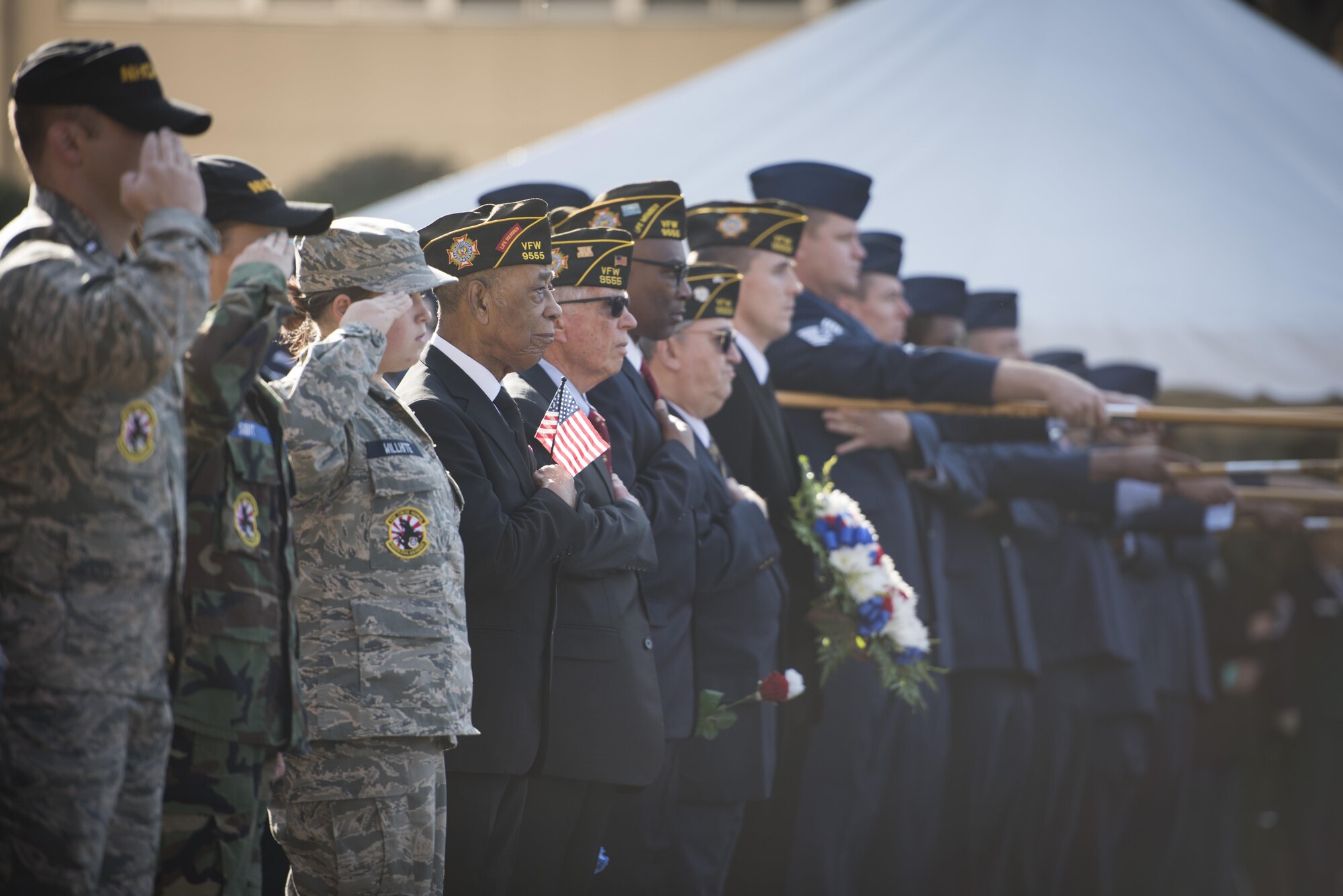 A veteran holds an American flag in formation during a Veterans Day Ceremony, Nov. 10, 2017, at Yokota Air Base, Japan.