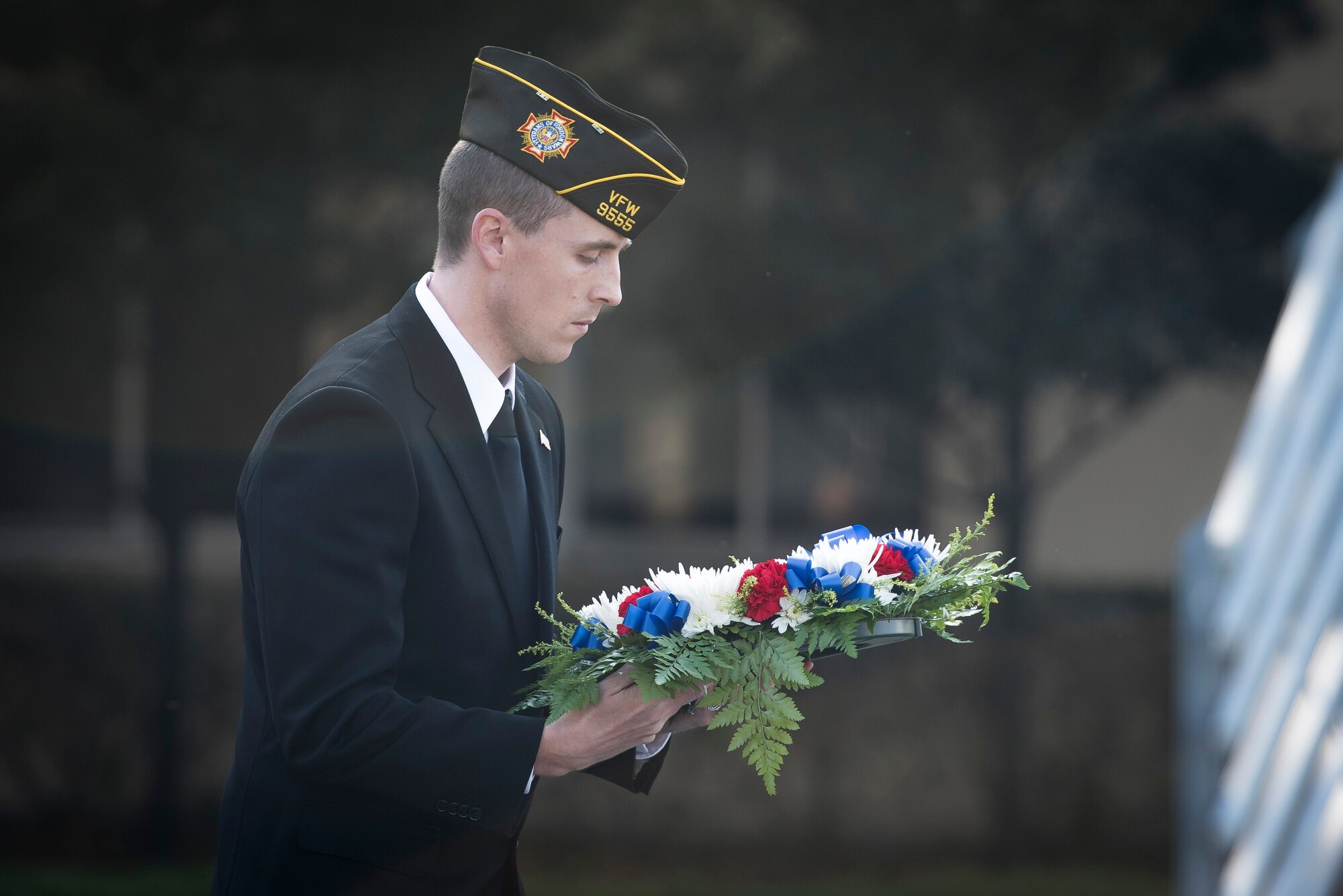 A veteran carries a memorial wreath during a Veterans Day Ceremony, Nov. 10, 2017, at Yokota Air Base, Japan.