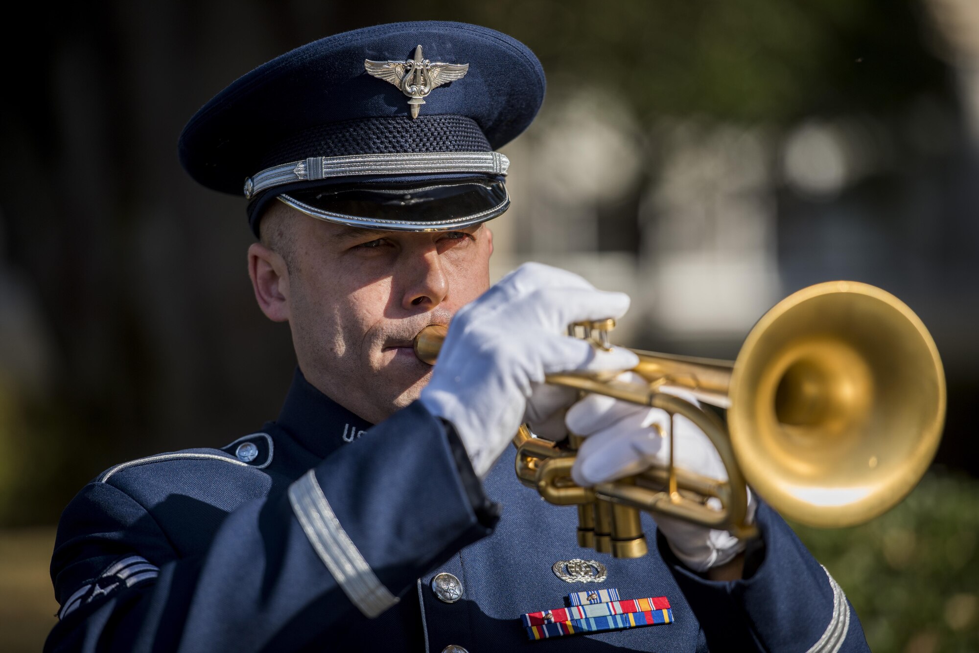 A member of the U.S. Pacific Air Forces band plays Taps during a Veterans Day Ceremony, Nov. 10, 2017, at Yokota Air Base, Japan.