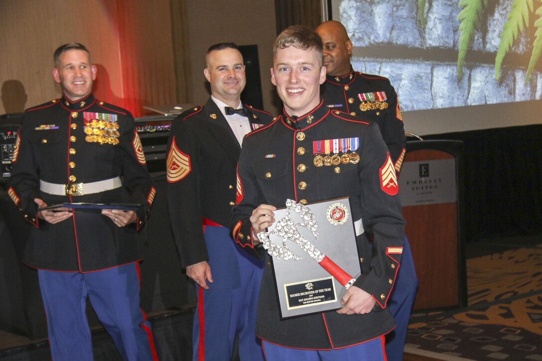 Sgt. Shawn Stevens, recruiter, Recruiting Substation South Omaha, Neb., receives a plaque for winning Marine Corps Recruiting Station Des Moines’ Rookie Recruiter of the Year at Embassy Suites in Des Moines, Iowa, Nov. 11, during the 242nd Marine Corps Birthday Ball. (Official Marine Corps photo by Sgt. Levi Schultz)